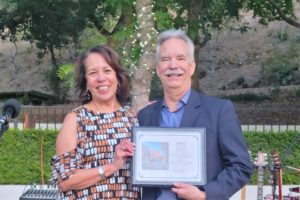 Dawn Argula Presents Plaque to Marc Roberts